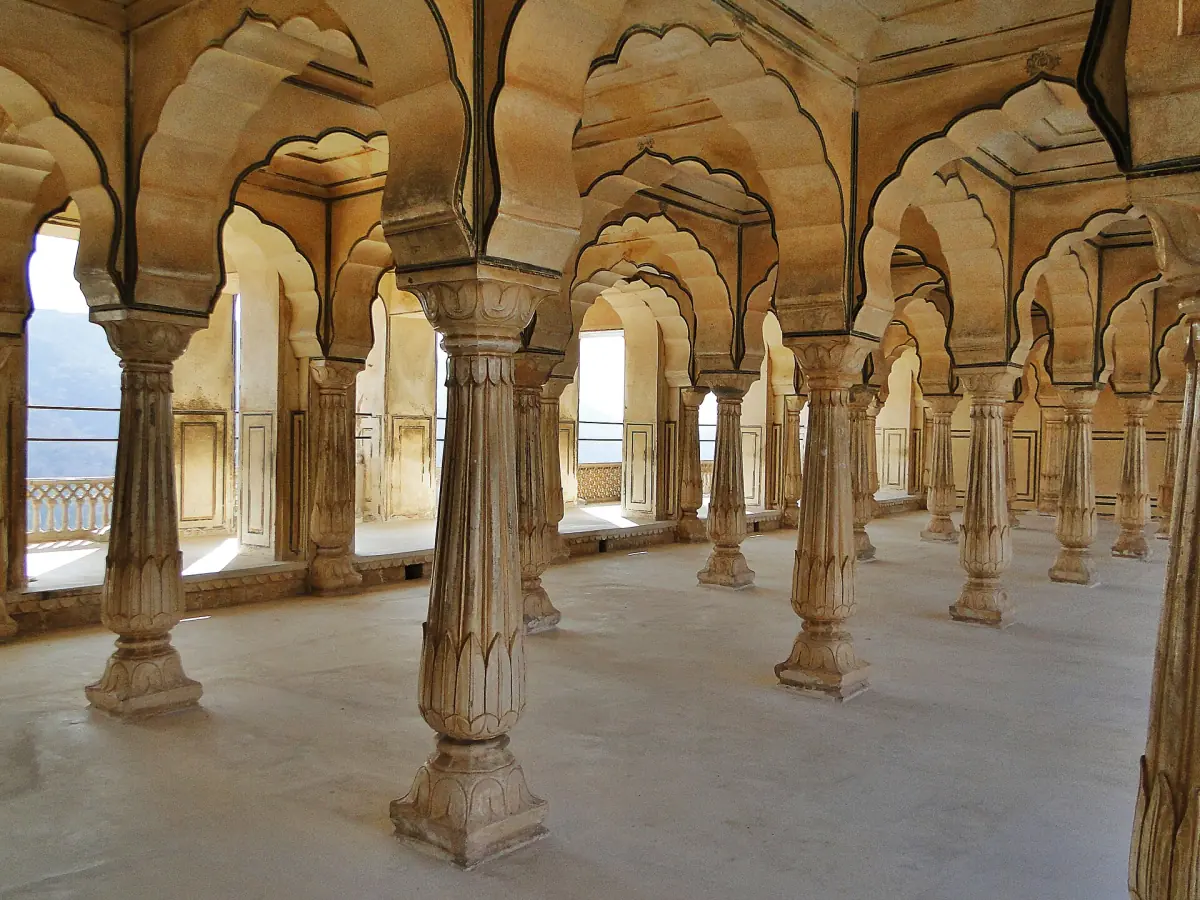 Carved columns in a hall of Amber Fort